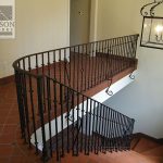 Downward curved stair rail Stair railing on a downward curve