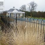 Hairpin style security fence around a swimming pool Hairpin style wrought iron security fence around a swimming pool