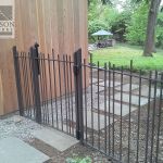 Contemporary iron fence and gate Contemporary wrought iron fence and gate