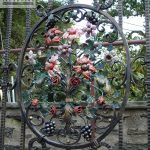 Wrought iron gate with various metal ornaments Wrought iron gate with various metal ornaments